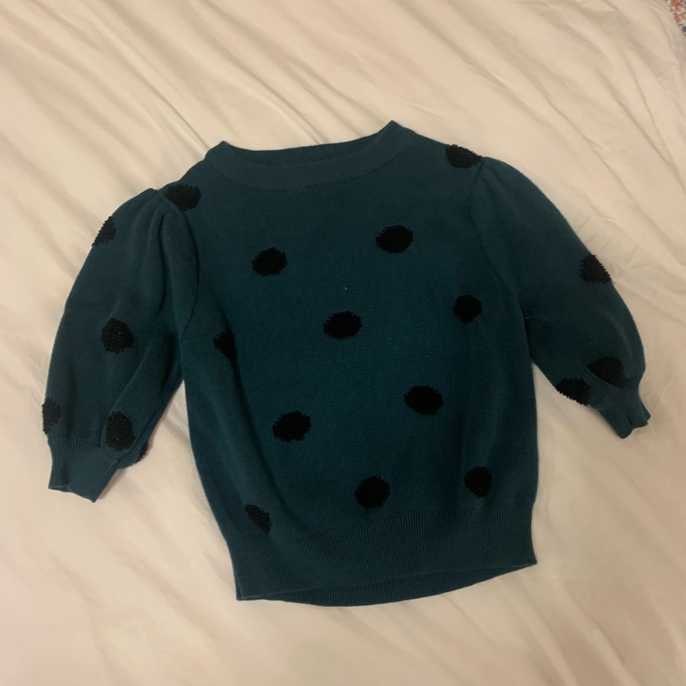 Green sweater with polka dots